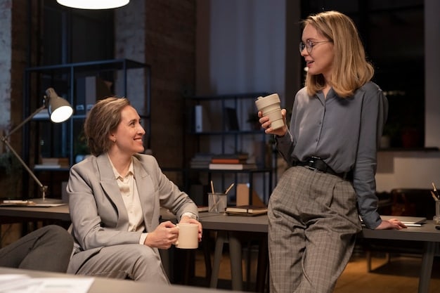 Two colleagues in a modern office having a calm and constructive conversation, actively listening to each other with an open and understanding body language. The focus is on active listening and empathetic communication.