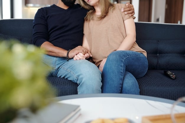 A couple sitting on a couch, holding hands and looking at each other with caring expressions. The scene is warm and inviting, symbolizing emotional support and empathic understanding in a close relationship.