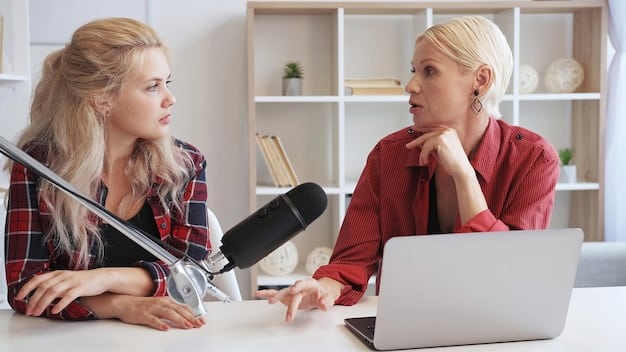 Two colleagues sitting at a desk in an office, having a serious but respectful conversation. One person is actively listening while the other is speaking with a calm and composed demeanor.