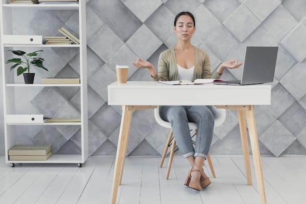 A person practicing mindfulness meditation at their work desk, amidst a minimalistic and organized workspace, promoting the idea of incorporating mindfulness into daily work life.