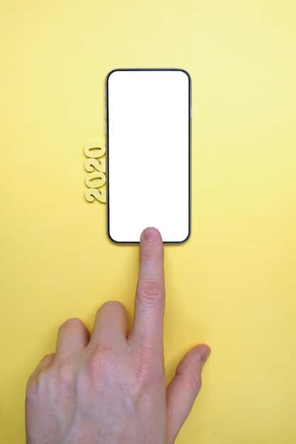 A close-up of a hand hovering over smartphone, with a notification icon displaying hundreds of unread emails. The background is blurred, suggesting the person is on-the-go. The screen is slightly cracked, implying a sense of frustration.