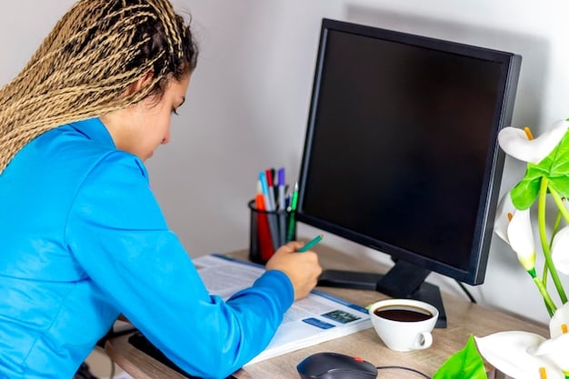 A person sitting at a desk, focused on a single task displayed on their computer screen, highlighting the principle of focused execution in the Ivy Lee Method.