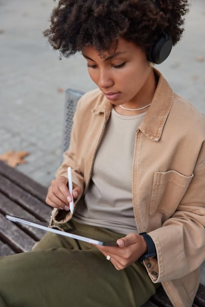 A person smiling and feeling relaxed while crossing off a completed task from their prioritized list, illustrating the stress-reducing benefits of the Ivy Lee Method.