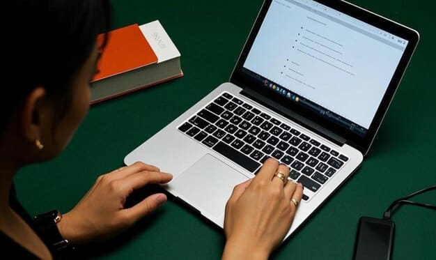 An image of a person crafting a personalized email on their laptop, emphasizing the importance of tailored communication in successful follow-ups.