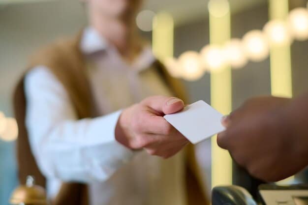 A person confidently exchanging a business card with another professional at a networking event, with smiles and positive body language, symbolizing a successful connection.