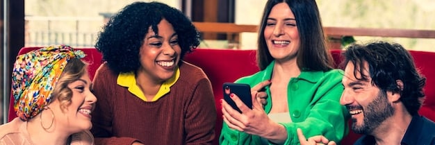 A group of diverse professionals happily reconnecting and chatting at a networking event, depicting the positive energy and benefits of re-establishing connections.