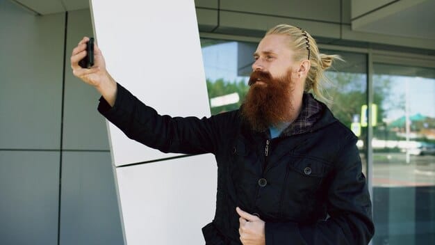 A person confidently presenting an elevator pitch in front of a whiteboard with key points outlined with a marker. The whiteboard should display words like 